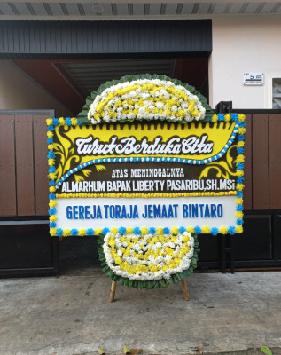Papan Bunga Duka di Airputih